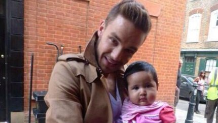Liam payne holding baby 1