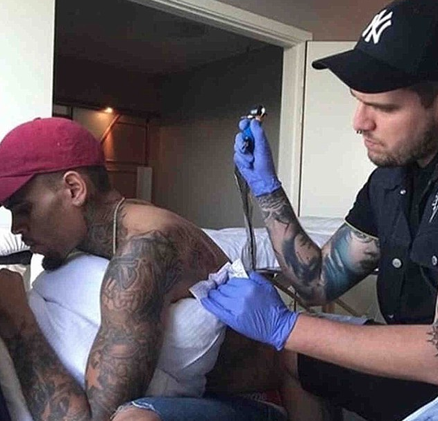 Did Chris Brown get a tattoo of Rihanna's battered face? - Telegraph