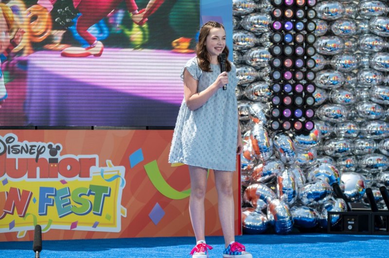 Libby Rue, star of Disney Junior’s Alice’s Wonderland Bakery, announced the series renewal on stage